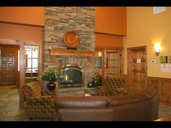 a living room with a fireplace and a couch