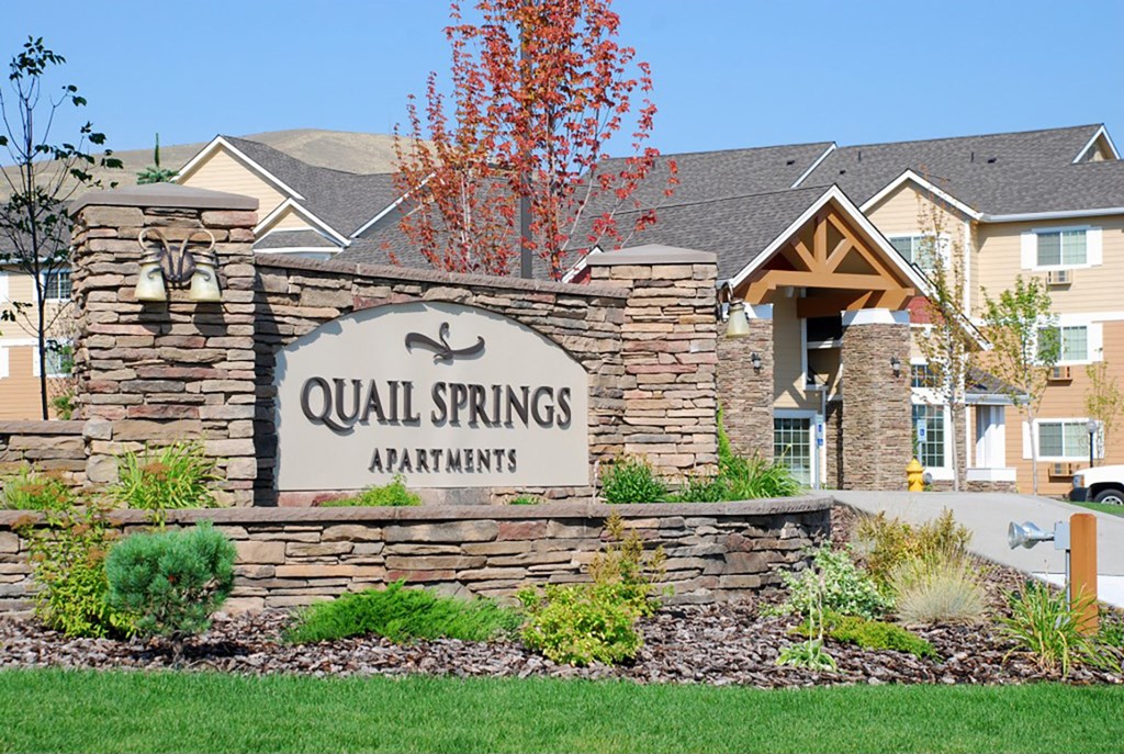 a sign apartments in front of a house at Quail Springs, West Richland