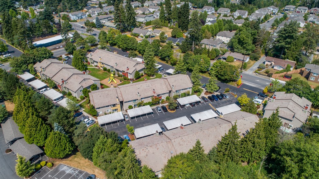 an aerial view of a neighborhood with houses and trees at Quartz Creek, Washington, 98043