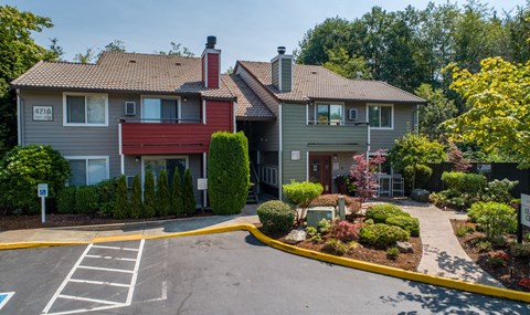 the view of a house with a driveway and landscaping in front of it at Quartz Creek, Washington, 98043