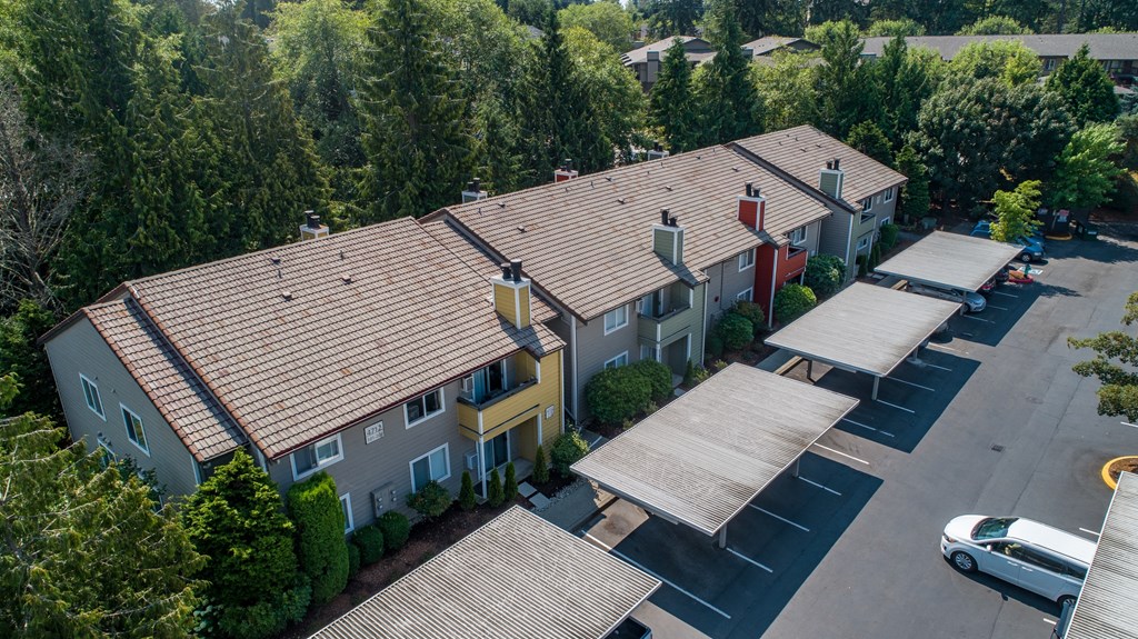 an aerial view of a building with a parking lot and trees at Quartz Creek, Washington