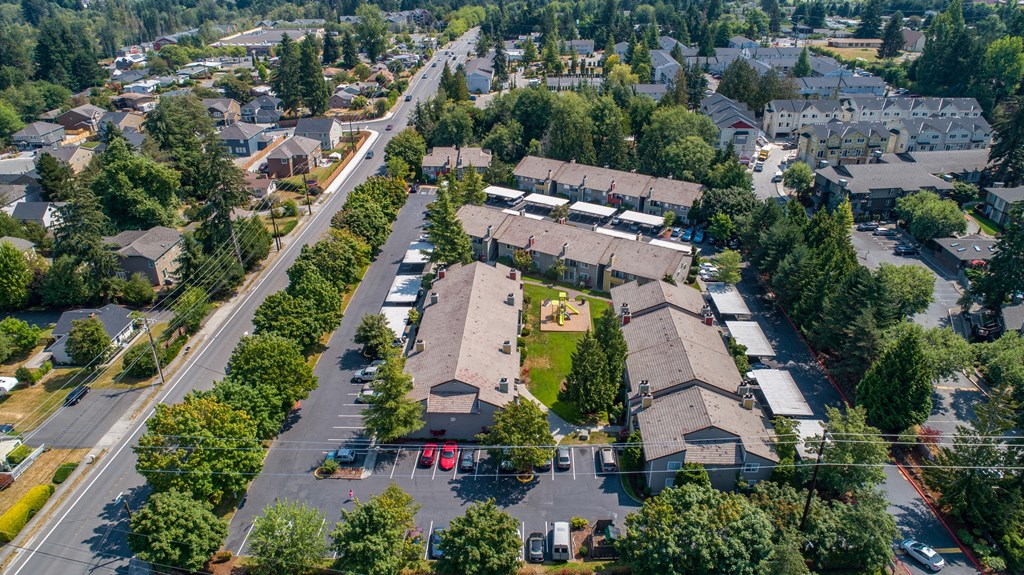 an aerial view of a neighborhood with houses and trees at Quartz Creek, Washington, 98043