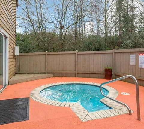 a small pool in the backyard of a house with a fence at Quartz Creek, Washington, 98043