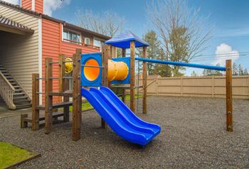 a playground with a blue slide and yellow at Quartz Creek, Washington