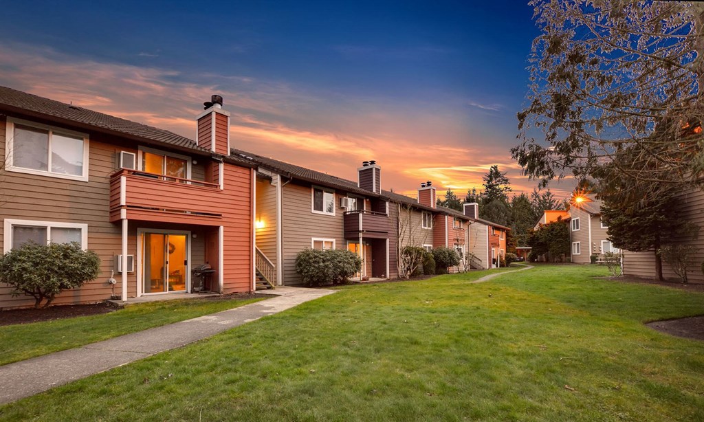 a row of houses on a city street at sunset at Quartz Creek, Washington, 98043