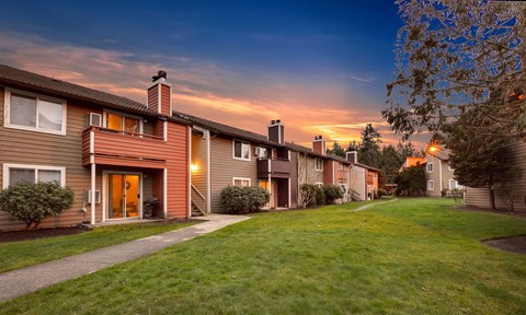 a row of houses on a city street at sunset at Quartz Creek, Washington, 98043