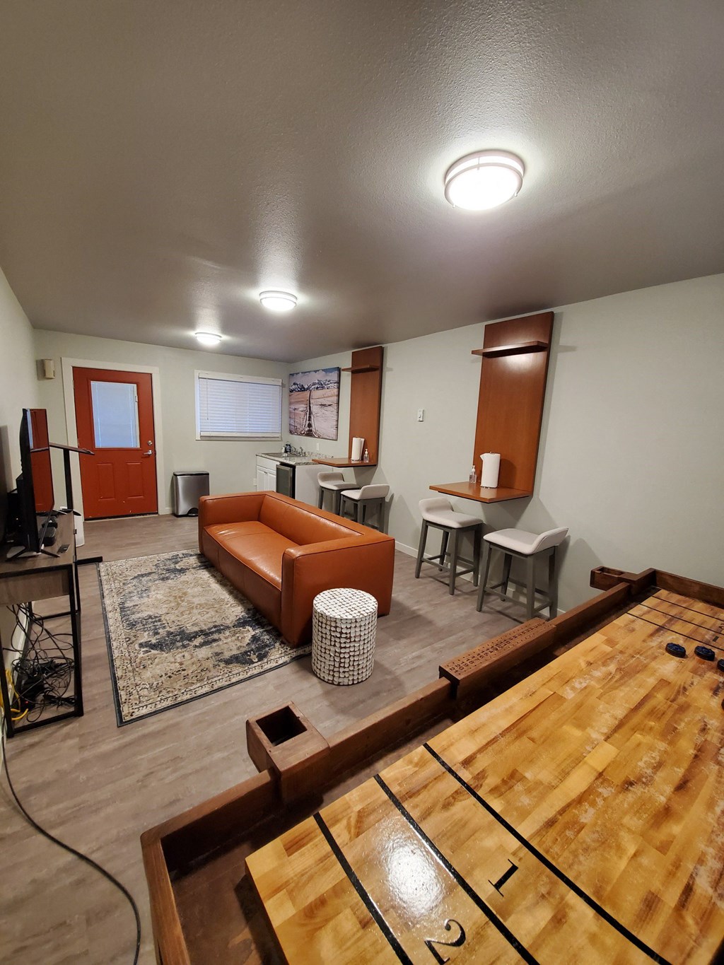 an overhead view of a living room with a ping pong table and a kitchen at Rock Creek, Montana