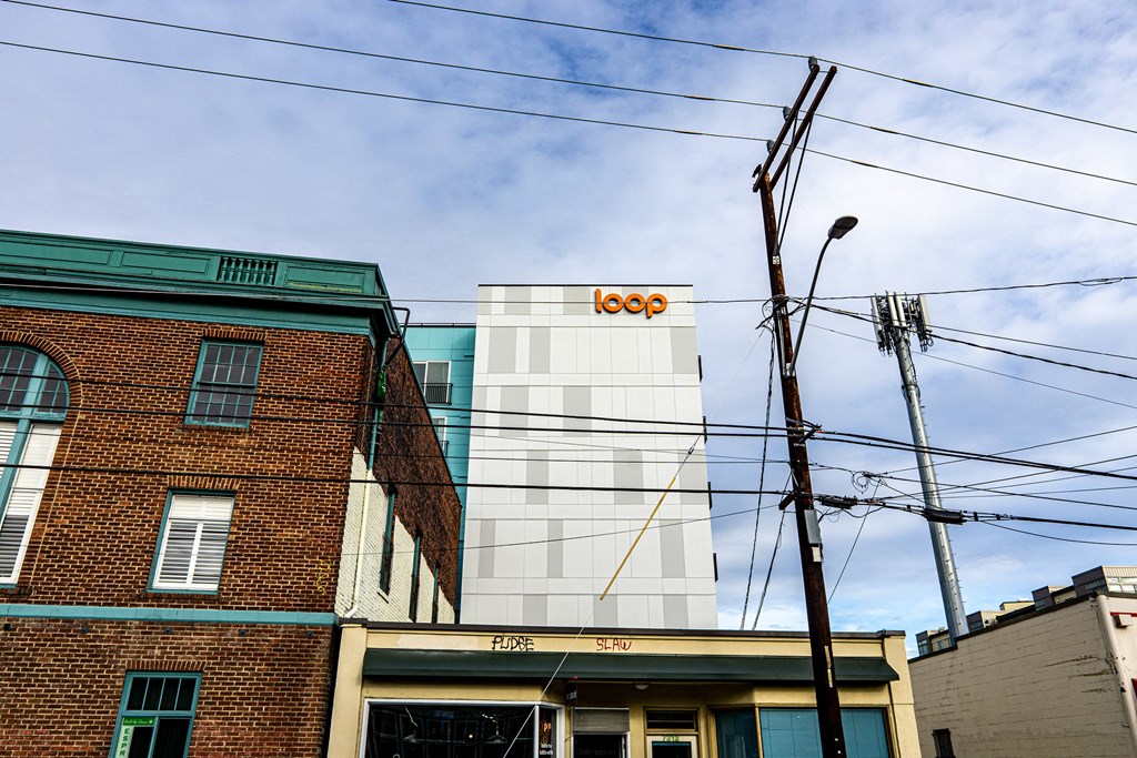 the facade of a building with the google logo on it at The Loop at Green Lake, Seattle, 98115