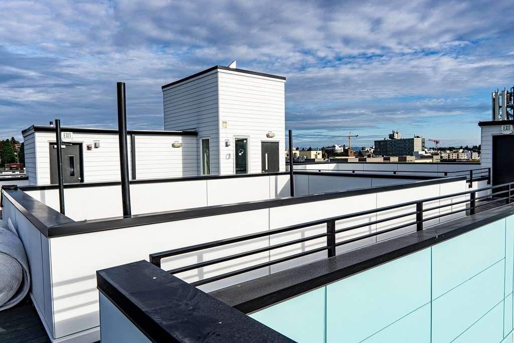 a roof deck with a view of the city at The Loop at Green Lake, Seattle
