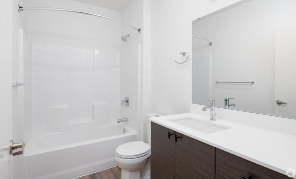 a bathroom with a sink toilet and a shower at The Loop at Green Lake, Seattle, WA