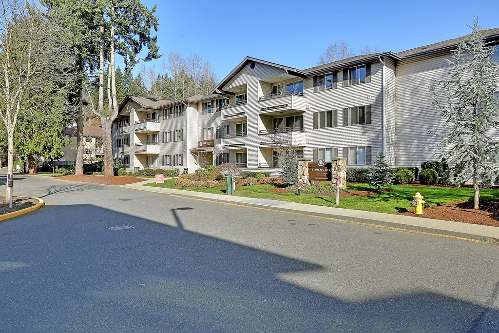 an empty street in front of an apartment building  at Townside Flats, Redmond, Washington