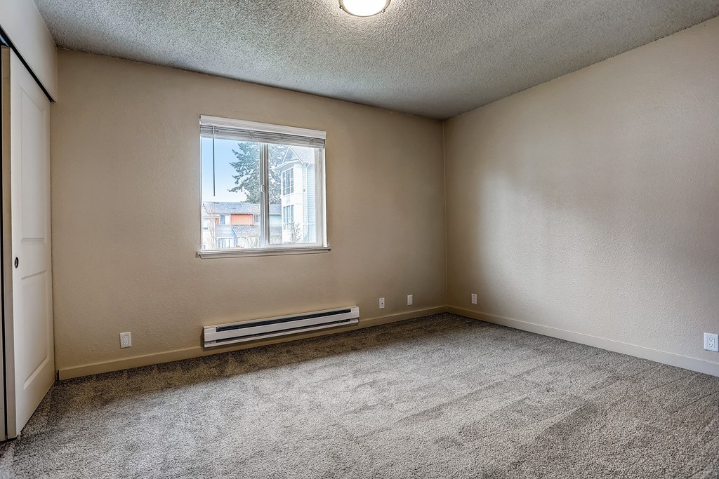 an empty living room with carpet and a window at Woodcreek, Poulsbo, 98370