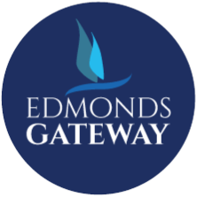 a blue logo with the words edmonds gateway with a blue flame