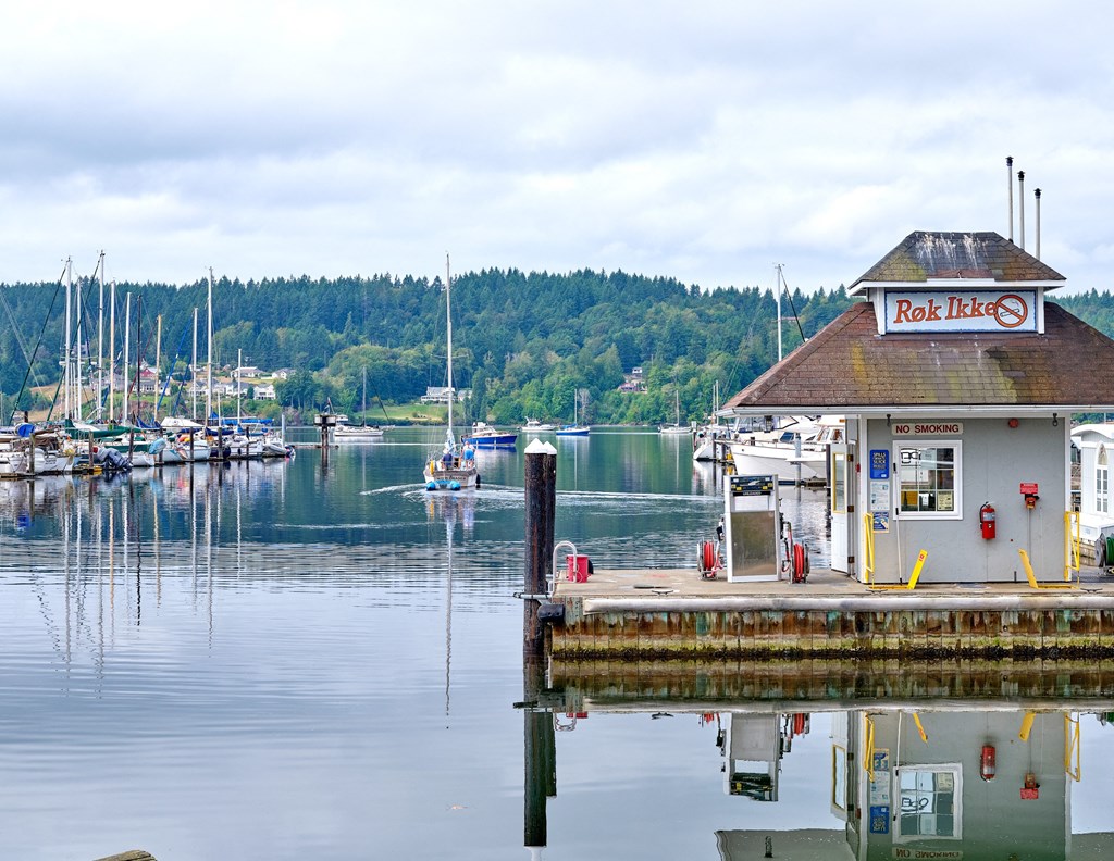 a dock on the water with boats in a marina at Woodcreek, Poulsbo Washington