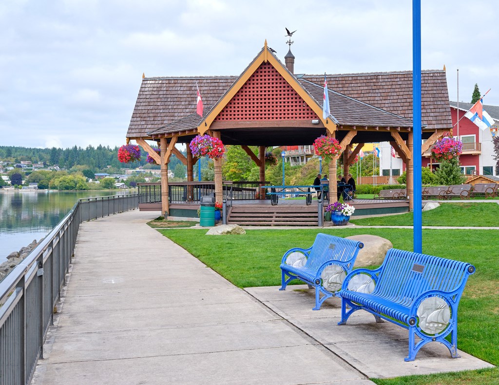 a park with benches and a gazebo near the water at Woodcreek, Poulsbo, 98370
