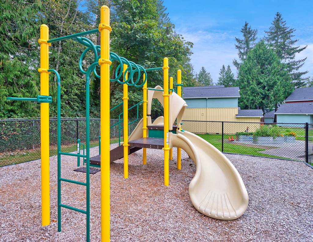 our playground is equipped with a swing set and slides at Woodcreek, Washington