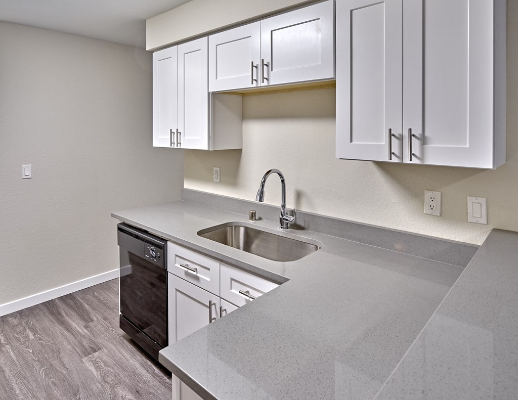 Kitchen with appliances and cabinets at Arterra Apartments, Kent, WA, 98030