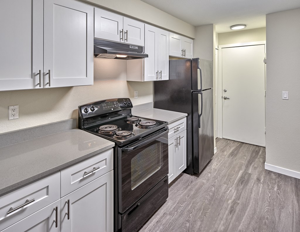 Kitchen with appliances at Arterra Apartments, Kent, 98030