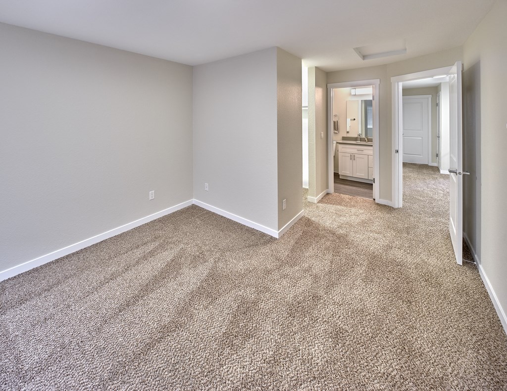 Bedroom area with wooden floor at Arterra Apartments, Kent