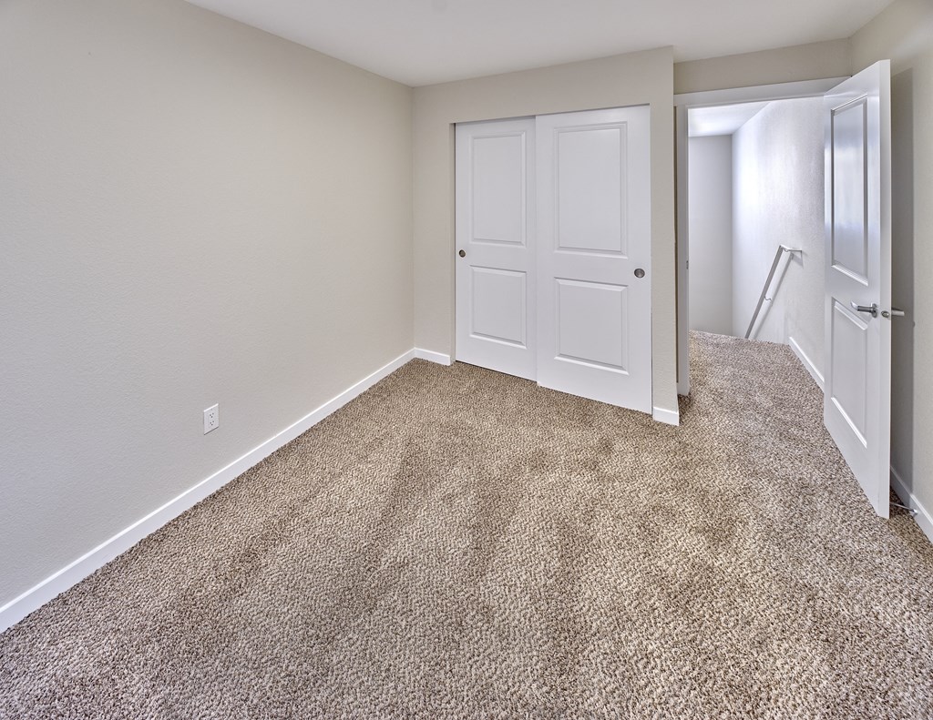 Bedroom area with wooden flooring at Arterra Apartments, Kent, Washington