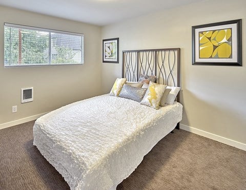 a bedroom with a bed and two windows  at 3030 Lake City, Seattle
