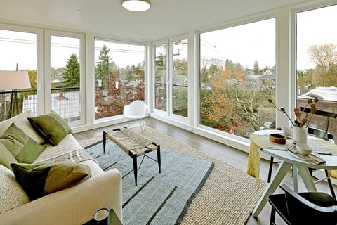 Living room with view of city and trees.at 19th & Mercer, Seattle, 98112