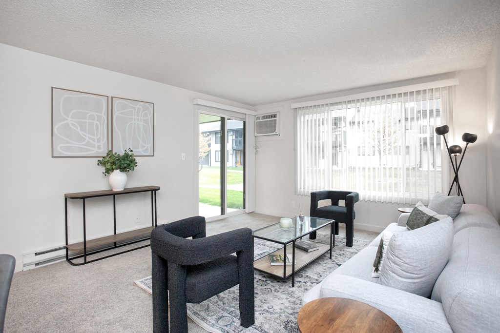 a living room with a couch and chairs and a coffee table  at Brix, Washington