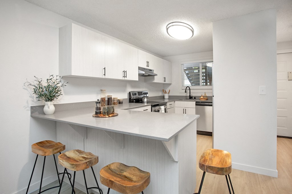 a kitchen with a large island with three stools at Brix, Washington, 99362
