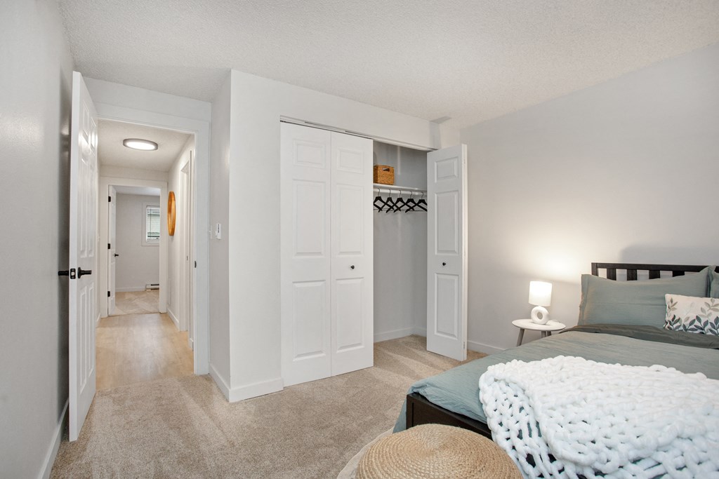 a bedroom with a bed and a hallway with closets at Brix, Walla Walla, WA, 99362