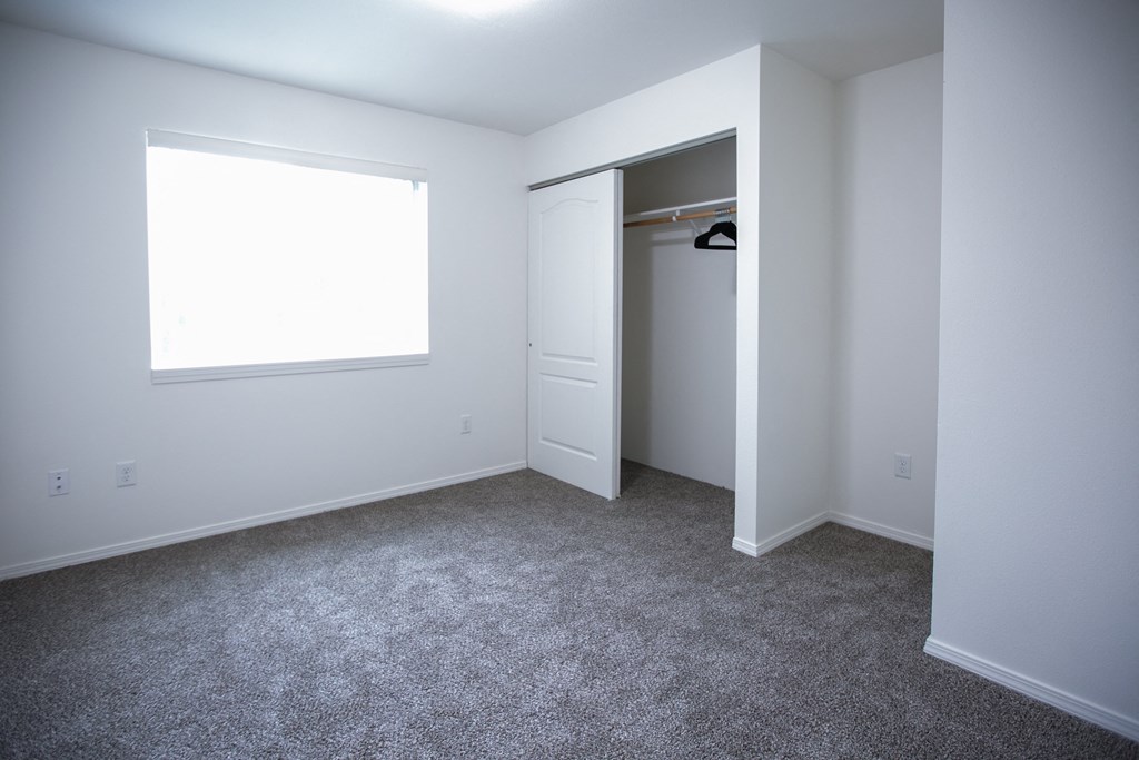 an empty room with a closet and a window at Canyon View, Lewiston, ID 83501