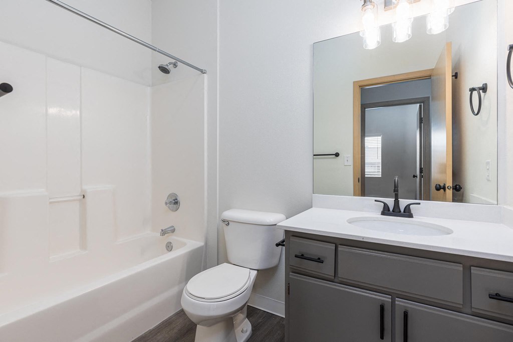 a bathroom with a sink toilet and a bath tub  at Shoreline Village, Richland, WA, 99352