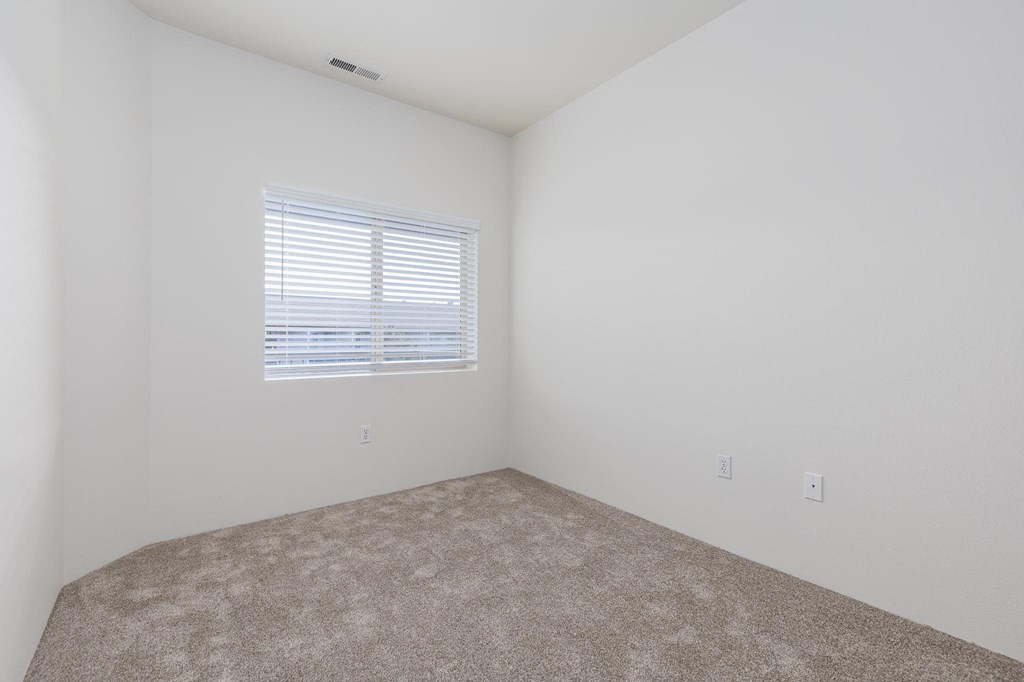an empty room with a window and carpet  at Shoreline Village, Washington
