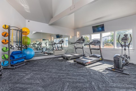 a gym with treadmills and other exercise equipment at the enclave at university heights  at Shoreline Village, Richland, WA
