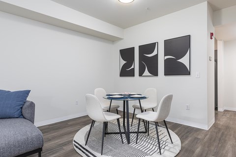 a dining room with a table and chairs and a couch  at Shoreline Village, Richland, 99352