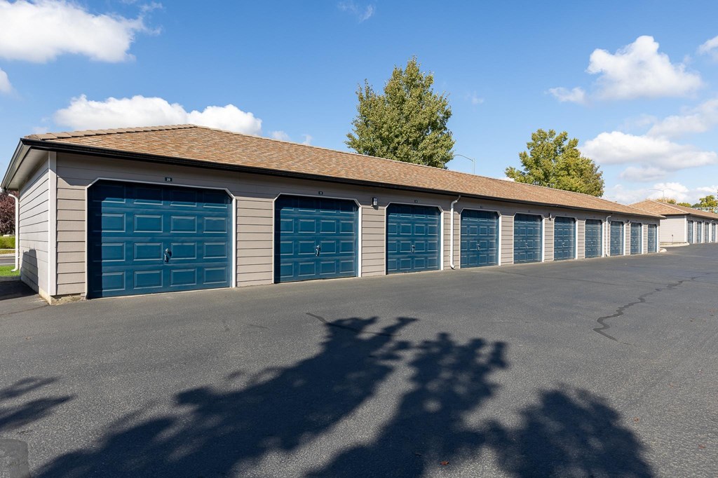 a long row of garages with blue garage doors  at Shoreline Village, Richland, WA, 99352