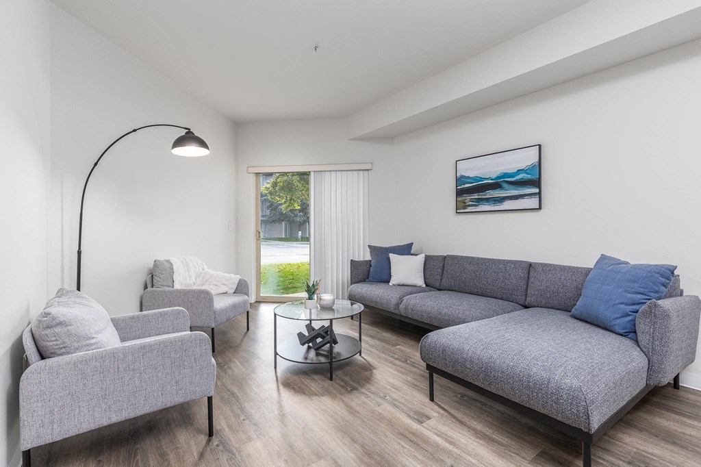 a living room with a couch and two chairs  at Shoreline Village, Washington