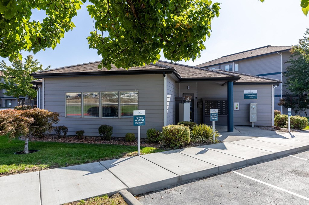 a small gray house with a sidewalk in front of it  at Shoreline Village, Washington