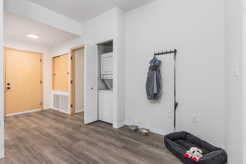 a living room with a couch and a door to a closet  at Shoreline Village, Washington