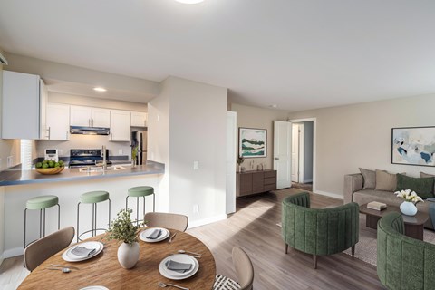 Dining area with wood table inside 3030 Lake City Apartments in Lake City, Seattle