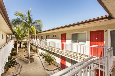 Pacific Sands walkway with tropical landscaping at Pacific Sands, San Diego, CA, 92117