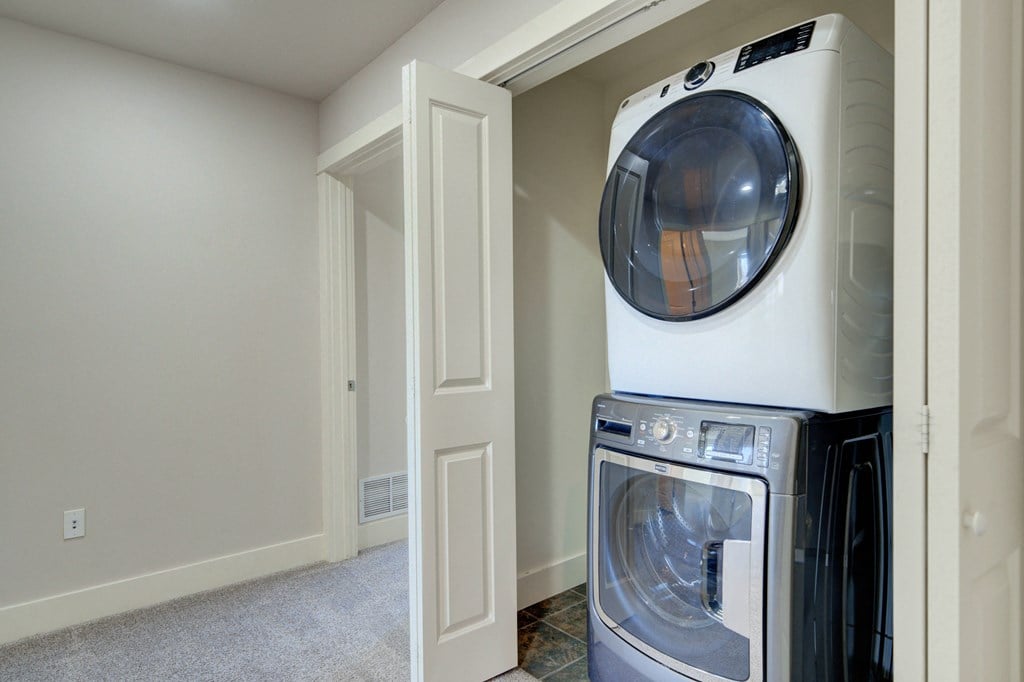an empty laundry room with a washer and dryer at Copper Pines, Bozeman, MT, 59718