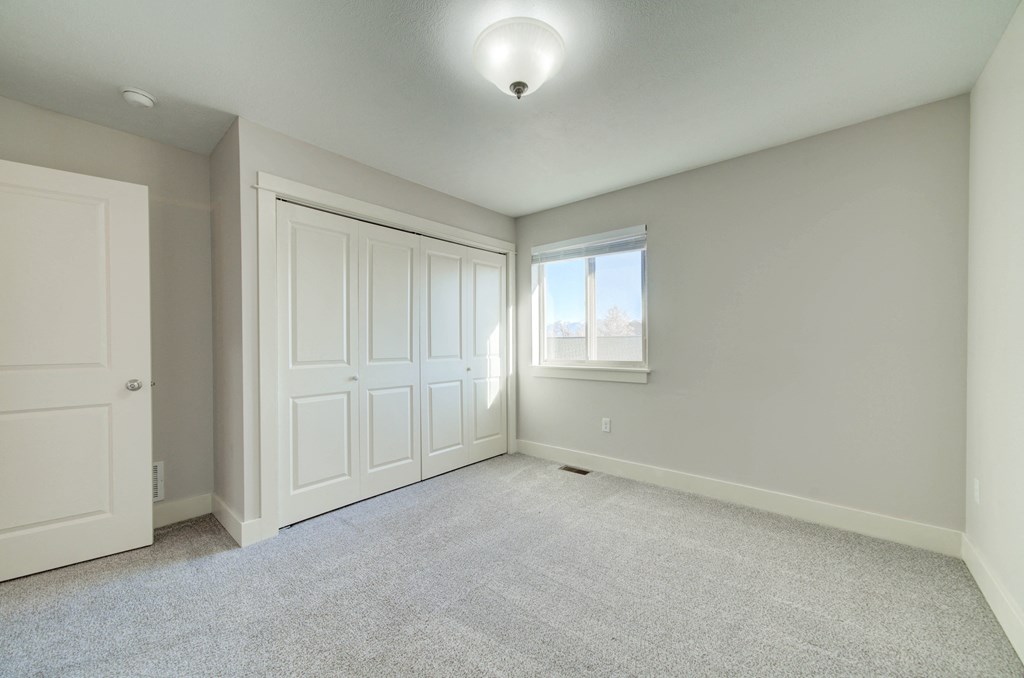 an empty room with two closets and a window at Copper Pines, Bozeman, MT, 59718