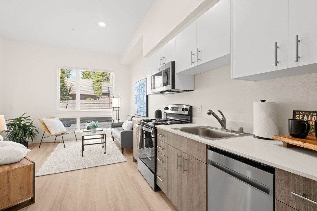 a rendering of a kitchen and living room in an apartment at The Duo, University Place, WA 98466