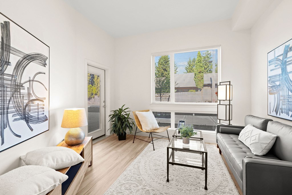 a living room with a couch and a coffee table at The Duo, University Place, 98466