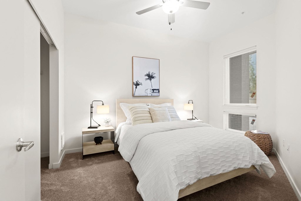 a bedroom with a bed and a ceiling fan at The Duo, Washington, 98466