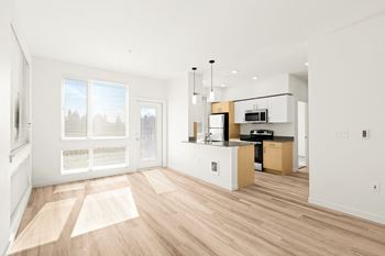 Light brown faux wood flooring at The Duo Apartments in University Place at The Duo, University Place