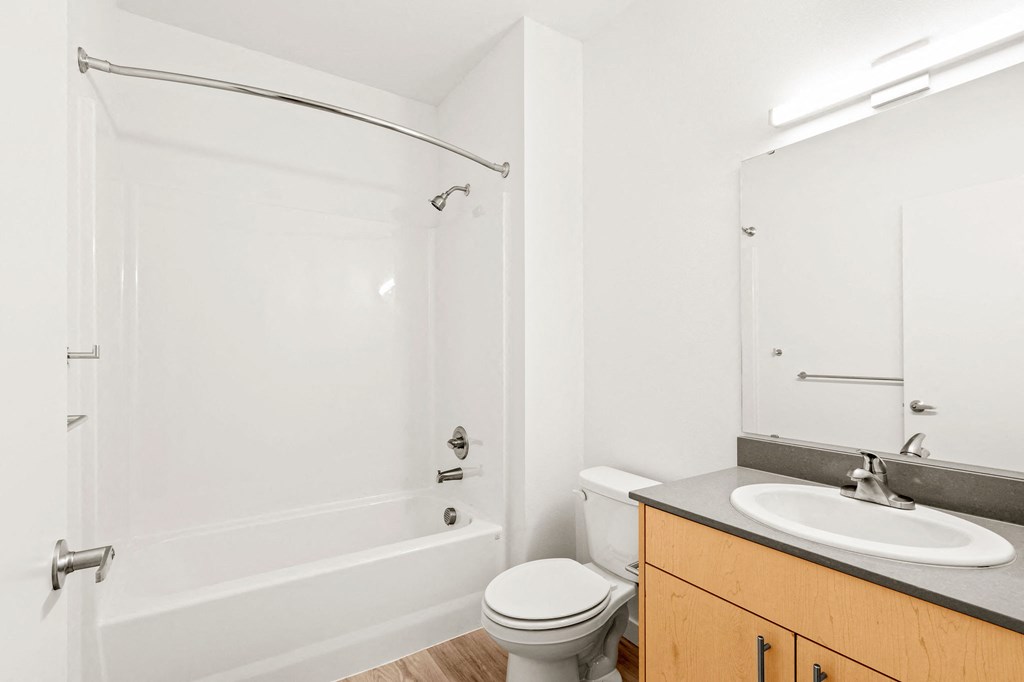 a bathroom with a sink toilet and a shower at The Duo, University Place, WA