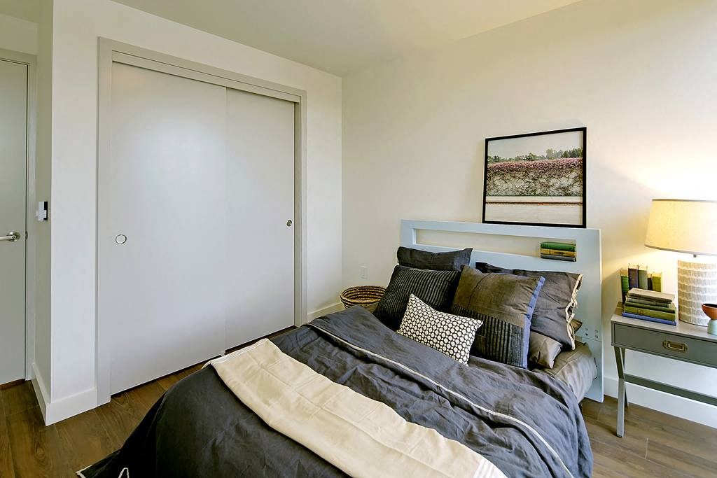 Large bedroom with large double closet doors. Bedroom can fit a queen or king sized bed.at 19th & Mercer, Seattle