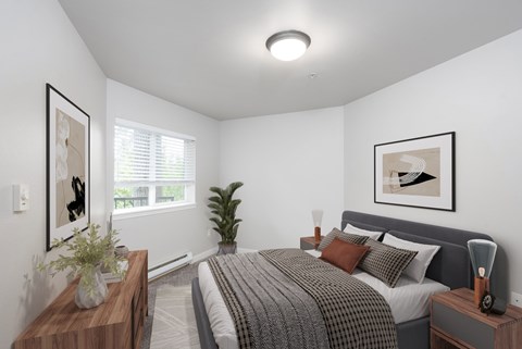 A bedroom with a bed, nightstand, and a plant.