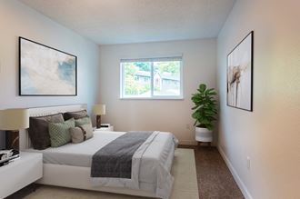 Bright bedroom with taupe carpet, white walls and white horizontal blinds on a window on the opposite wall.
